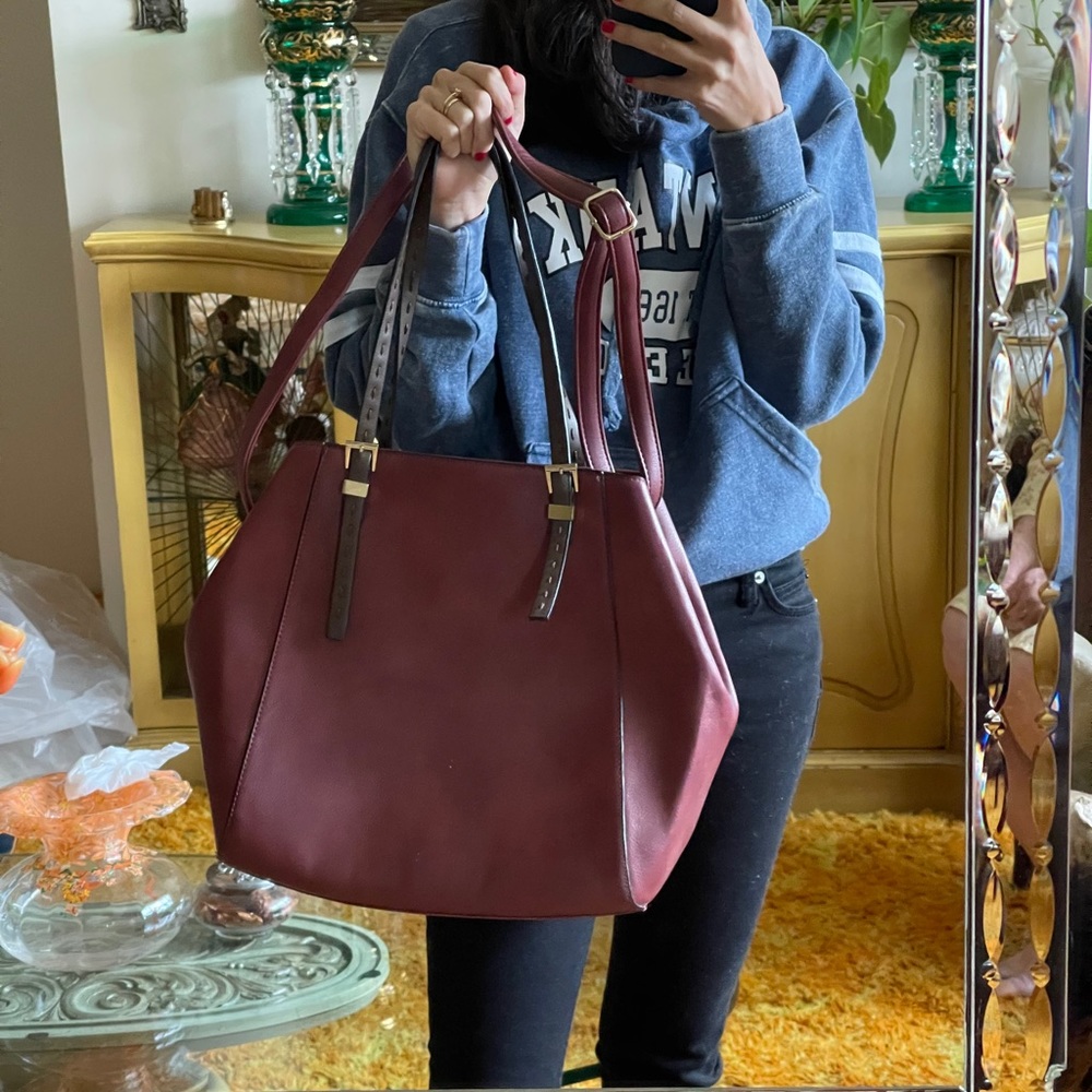 ‏A New Burgundy Bag